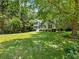 A beautiful two-story home on a large lot with mature trees and well-maintained lawn at 5020 Bayberry Dr, Cumming, GA 30040