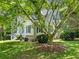 Exterior home featuring an ample front yard with mature landscaping and traditional architecture at 5020 Bayberry Dr, Cumming, GA 30040