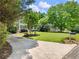Manicured front yard with a long driveway to the side-entry garage at 5020 Bayberry Dr, Cumming, GA 30040