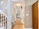 Inviting hallway featuring hardwood floors, a staircase and natural light at 5020 Bayberry Dr, Cumming, GA 30040