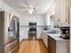 Modern kitchen featuring stainless steel appliances, white cabinets, and functional layout at 5020 Bayberry Dr, Cumming, GA 30040