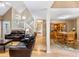 Spacious living room with a dining area, leather couches and hardwood flooring at 5020 Bayberry Dr, Cumming, GA 30040