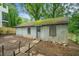 Exterior of a weathered outbuilding with a corrugated metal exterior and moss-covered roof at 724 Bellemeade Nw Ave, Atlanta, GA 30318
