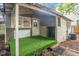 View of an exterior structure with artificial turf and a covered space at 724 Bellemeade Nw Ave, Atlanta, GA 30318