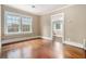 Bedroom shows hardwood floors, natural light, and neutral walls with easy doorway access at 724 Bellemeade Nw Ave, Atlanta, GA 30318