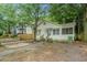 Charming single-story home with a screened-in porch, steps and landscaping in the front yard at 724 Bellemeade Nw Ave, Atlanta, GA 30318