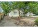 Charming single-story home with a covered porch and mature trees providing shade at 724 Bellemeade Nw Ave, Atlanta, GA 30318