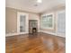Inviting living room featuring a stone fireplace and gleaming hardwood floors at 724 Bellemeade Nw Ave, Atlanta, GA 30318