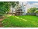 Expansive fenced-in backyard with a patio and tiered wooden deck at 740 Paris Dr, Lawrenceville, GA 30043