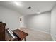 Spacious basement featuring gray carpet and an upright piano at 740 Paris Dr, Lawrenceville, GA 30043
