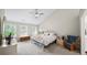 Spacious bedroom featuring a vaulted ceiling, three windows, and neutral decor at 740 Paris Dr, Lawrenceville, GA 30043