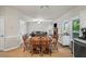 Bright dining area with a wooden table set, adjacent to the living room, perfect for Gathering meals at 740 Paris Dr, Lawrenceville, GA 30043