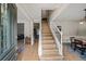 Spacious foyer with staircase and an open view to the dining and living areas, perfect for entertaining at 740 Paris Dr, Lawrenceville, GA 30043