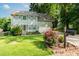Charming home featuring a manicured lawn and lush plantings at 740 Paris Dr, Lawrenceville, GA 30043