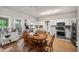 Well-lit kitchen and dining area featuring white cabinets, modern appliances, and a cozy table set at 740 Paris Dr, Lawrenceville, GA 30043