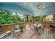 Inviting screened-in porch with a ceiling fan and an outdoor dining set at 740 Paris Dr, Lawrenceville, GA 30043