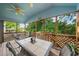 Inviting screened-in porch with a ceiling fan and an outdoor dining set at 740 Paris Dr, Lawrenceville, GA 30043