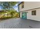 Backyard area featuring a painted wooden deck with access to the house via blue double doors at 8649 Cedar Creek Rdg, Riverdale, GA 30274