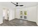 Bedroom with French doors to backyard, modern fan, and ensuite bathroom providing modern comfort and privacy at 8649 Cedar Creek Rdg, Riverdale, GA 30274