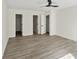 Large bedroom featuring wood floors, great lighting, and large windows at 8649 Cedar Creek Rdg, Riverdale, GA 30274