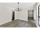 Dining room featuring hardwood floors, modern light fixture, and great light at 8649 Cedar Creek Rdg, Riverdale, GA 30274