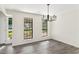 Dining room with wood flooring, bright light, and plenty of natural light through large windows at 8649 Cedar Creek Rdg, Riverdale, GA 30274