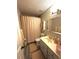 Well-lit bathroom with a vanity, toilet, and shower/tub combination at 227 Bennett Farms Trl, Acworth, GA 30102