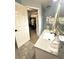 Bathroom featuring granite counters, modern sink and fixtures, with an open door into walk-in closet at 227 Bennett Farms Trl, Acworth, GA 30102