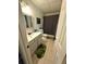 Bathroom featuring vanity, tile flooring and shower/tub with curtain at 227 Bennett Farms Trl, Acworth, GA 30102