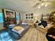 Cozy bedroom with hardwood floors, natural lighting, and comfortable seating at 227 Bennett Farms Trl, Acworth, GA 30102