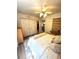 Cozy bedroom features soft textures, ample closet space, and a ceiling fan for added comfort at 227 Bennett Farms Trl, Acworth, GA 30102