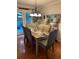 Dining room features a long table, hardwood floors, and backyard views at 227 Bennett Farms Trl, Acworth, GA 30102