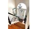Bright foyer with a high ceiling, chandelier, coat rack and an arched transom window above the front door at 227 Bennett Farms Trl, Acworth, GA 30102