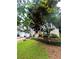 Inviting two-story home featuring a well-maintained lawn, mature trees, and welcoming front entrance at 227 Bennett Farms Trl, Acworth, GA 30102