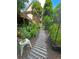 Backyard view featuring a wood chip path between raised garden beds and a two-story home at 227 Bennett Farms Trl, Acworth, GA 30102