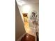 Upstairs hallway featuring laundry machines with tile flooring and decorative mirror at 227 Bennett Farms Trl, Acworth, GA 30102