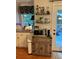 Eat-in kitchen with shelving, modern appliances and a door leading to a wood deck at 227 Bennett Farms Trl, Acworth, GA 30102