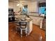 Charming kitchen with white cabinets, granite countertops, and a center island at 227 Bennett Farms Trl, Acworth, GA 30102