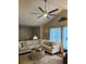 Spacious living room boasts a large sofa, vaulted ceilings, and natural light at 227 Bennett Farms Trl, Acworth, GA 30102