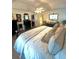 Bedroom with large bed, ceiling fan, and dresser with mirror at 227 Bennett Farms Trl, Acworth, GA 30102