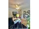 Bright office with plenty of sunlight, ceiling fan, and a modern desk setup at 227 Bennett Farms Trl, Acworth, GA 30102