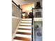 Staircase leading to the second floor, with views of the dining room and decorative elements at 227 Bennett Farms Trl, Acworth, GA 30102