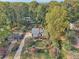 Overhead view of home with long driveway, mature trees, and lush landscaping at 2653 Partridge Trl, Duluth, GA 30097