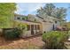 Back of home showing a screened in porch, wooden fence, and mature trees at 2653 Partridge Trl, Duluth, GA 30097