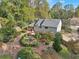 A wooden deck overlooks a charming backyard with a custom playhouse and lush landscaping at 2653 Partridge Trl, Duluth, GA 30097