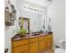 Bathroom featuring a double sink vanity with ample storage, and large mirror at 2653 Partridge Trl, Duluth, GA 30097