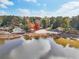 Lakefront beach access featuring clear skies and a calm lake reflecting the blue sky at 2653 Partridge Trl, Duluth, GA 30097