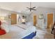 Spacious bedroom features vaulted ceiling, ceiling fan, and dedicated workspace at 2653 Partridge Trl, Duluth, GA 30097