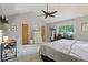 Vaulted ceiling bedroom with workspace, large window and neutral decor at 2653 Partridge Trl, Duluth, GA 30097