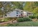 Charming two-story home with stone accents, a wooden deck, and mature landscaping at 2653 Partridge Trl, Duluth, GA 30097